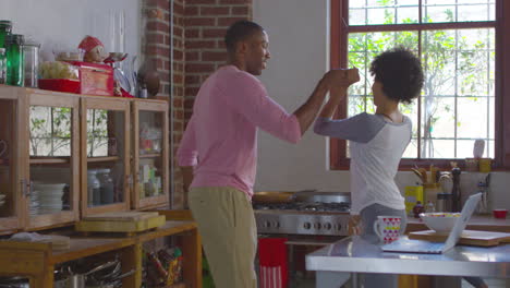 Young-black-couple-dancing-in-kitchen,-shot-on-R3D
