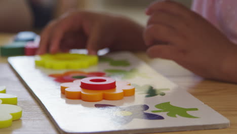 Close-Up-Of-Pupil-Using-Flower-Shapes-In-Montessori-School