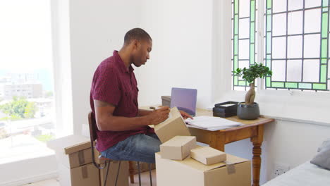 Man-Running-Business-From-Home-Dispatching-Goods