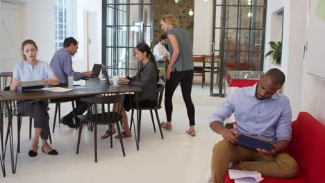Young-professionals-working-in-an-open-plan-office,-slow-motion