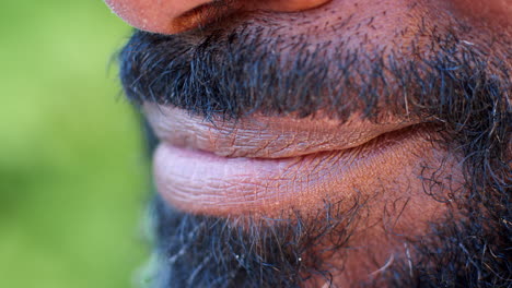 Side-view-of-the-face-of-a-smiling-black-man,-detail