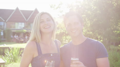 Portrait-Of-Couple-Enjoying-Outdoor-Summer-Drink-At-Pub
