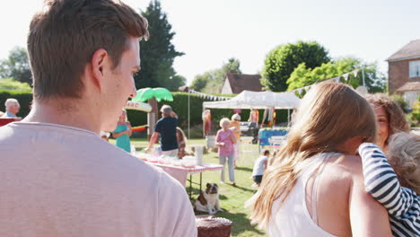 Slow-Motion-Shot-Of-Busy-Cake-Stall-At-Summer-Garden-Fete