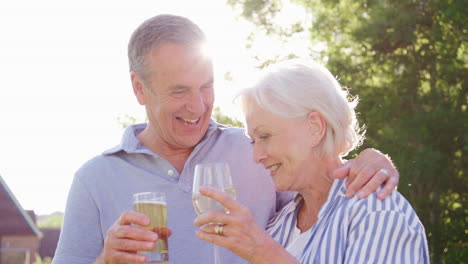 Portrait-Of-Senior-Couple-Enjoying-Outdoor-Summer-Drink-At-Pub