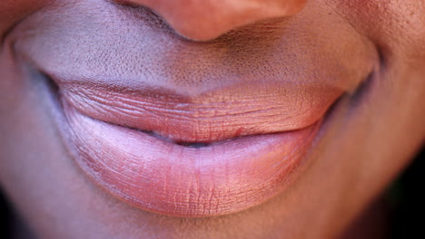 Close-up-of-a-mouth-of-a-smiling-black-woman