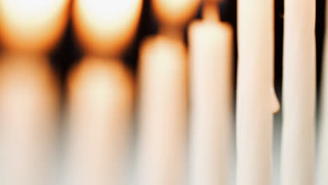 Selective-focus-tilt-shot-of-burning-candles-in-a-Jewish-menorah
