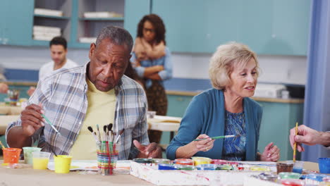 Group-Of-Retired-Seniors-Attending-Art-Class-In-Community-Centre