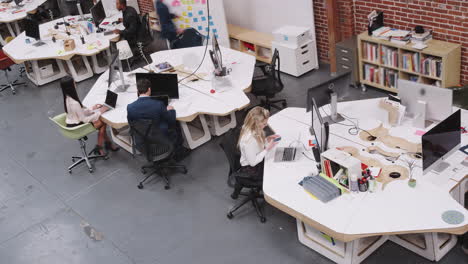Overhead-Time-Lapse-Of-Busy-Modern-Open-Plan-Office-With-Businesspeople-Arriving-And-Working-At-Desks