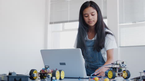 Female-Student-Building-And-Programing-Robot-Vehicle-In-After-School-Computer-Coding-Class