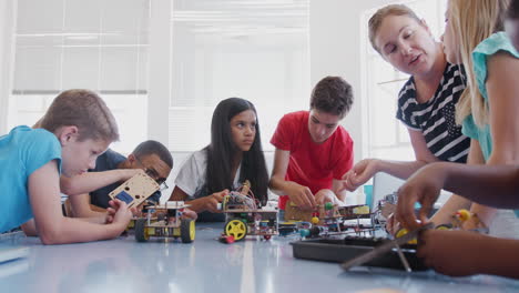 Students-With-Teachers-In-After-School-Computer-Coding-Class-Learning-To-Program-Robot-Vehicle
