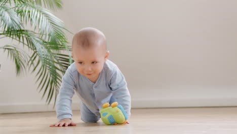 Curious-Baby-Boy-Playing-With-Toys-On-Floor-At-Home