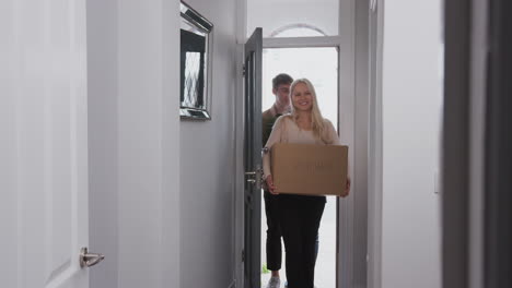 Group-Of-College-Student-Carrying-Boxes-Moving-Into-Accommodation-Together