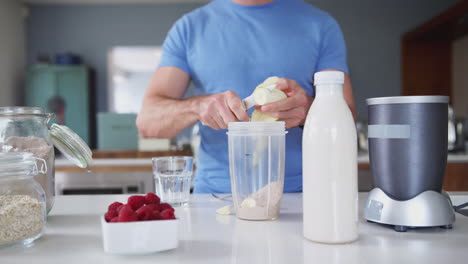 Close-Up-Of-Man-Making-Protein-Shake-After-Exercise-At-Home