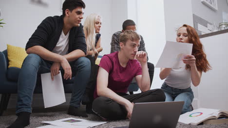 Group-Of-College-Students-In-Shared-House-Bedroom-Studying-Together