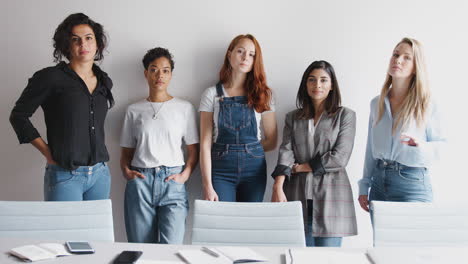Portrait-Of-Young-Female-Business-Team-Standing-Against-Wall-In-Modern-Office