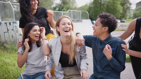 Women-Surprise-Three-Female-Friends-Talking-And-Laughing-In-Urban-Skate-Park