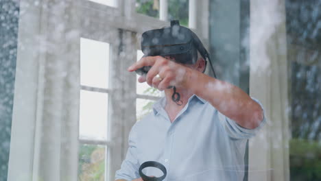 Blick-Durch-Das-Fenster,-Während-Ein-Reifer-Mann-Ein-Virtual-Reality-Headset-Trägt-Und-Gaming-Controller-In-Der-Hand-Hält