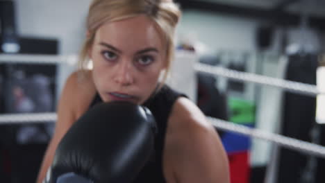 Point-Of-View-Shot-Of-Female-Boxing-Coach-In-Gym-Sparring-In-Boxing-Ring