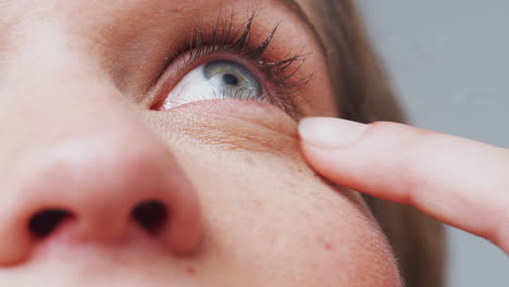 Extreme-Close-Up-As-Man-Puts-Eyedrops-Into-Eye-Shot-In-Slow-Motion