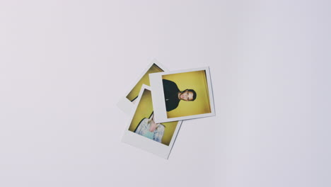 Instant-Film-Photos-Of-Young-Men-And-Women-Being-Thrown-Onto-Pile-On-White-Background
