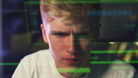 Male-Teenage-Hacker-With-Data-Reflected-From-Computer-Screen