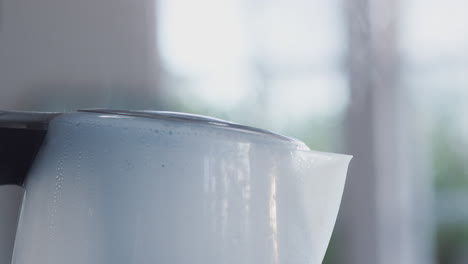 Close-Up-Of-Steam-Coming-Out-Of-Spout-Of-Boiling-Kettle
