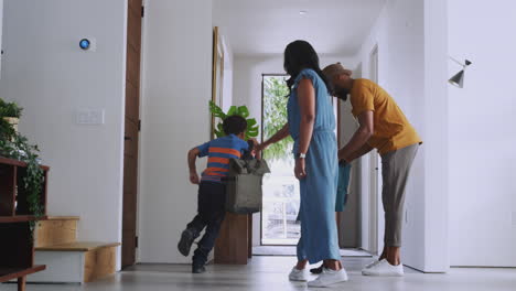Parents-And-Children-Opening-Front-Door-And-Leaving-Home-Together
