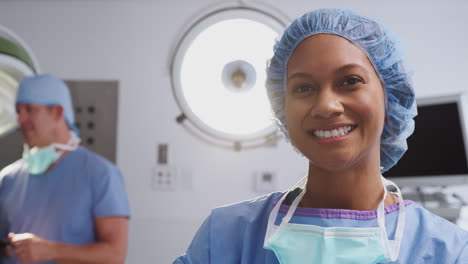 Portrait-Of-Female-Surgeon-Wearing-Scrubs-In-Hospital-Operating-Theater
