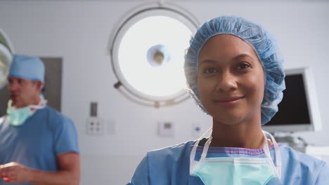 Portrait-Of-Female-Surgeon-Wearing-Scrubs-In-Hospital-Operating-Theater