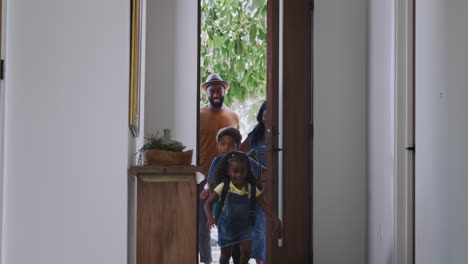 Parents-And-Children-Opening-Front-Door-And-Returning-Home-Together