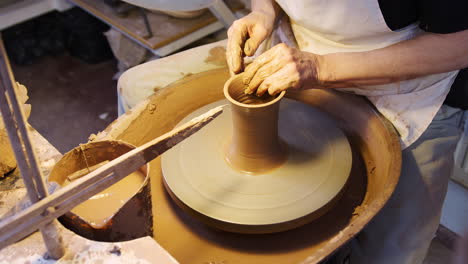 Close-Up-Of-Male-Potter-Shaping-Clay-For-Pot-On-Pottery-Wheel-In-Ceramics-Studio