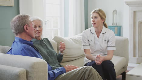 Female-Doctor-Giving-Bad-News-To-Senior-Couple-During-Home-Health-Visit