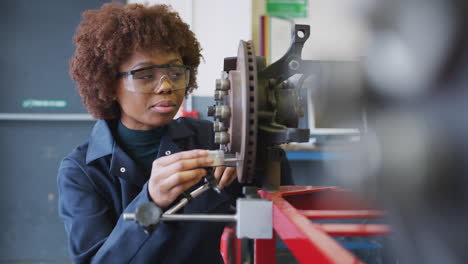 Female-Students-Checking-Car-Brake-Discs-On-Auto-Mechanic-Course-At-College