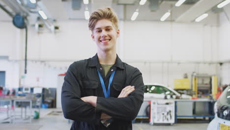 Portrait-Of-Male-Student-Studying-For-Auto-Mechanic-Apprenticeship-At-College