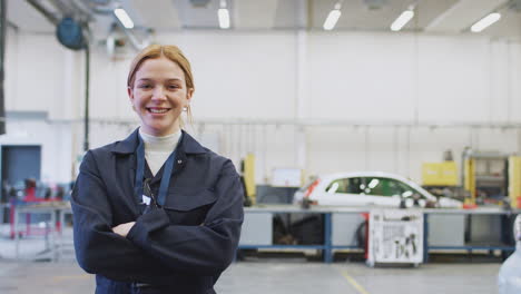 Portrait-Of-Female-Student-Studying-For-Auto-Mechanic-Apprenticeship-At-College