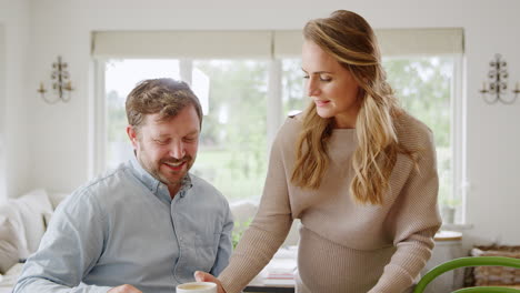 Couple-With-Pregnant-Wife-Reviewing-Domestic-Finances-Together