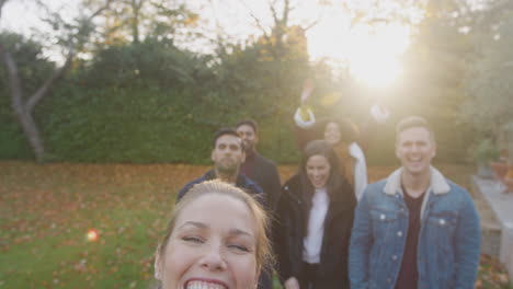 Portrait-Of-Multi-Cultural-Group-Of-Friends-Posing-For-Selfie-On-Outdoor-Walk-In-Countryside