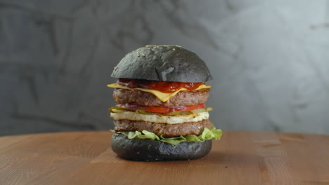 Turkey-black-burger-with-mushrooms-and-mushroom-sauce-on-black-stone-tray