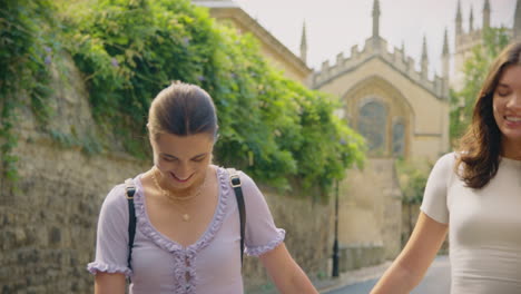Same-Sex-Female-Couple-Sightseeing-As-They-Hold-Hands-And-Walk-Around-Oxford-UK