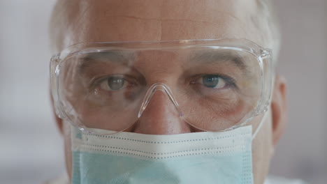 Portrait-of-confident-doctor-woman-face-close-up.-eyes-with-safety-glasses-and-protective-mask.-Research-Laboratory-Officer.-2019-Novel-Coronavirus-(2019-nCoV)-COVID-19-pandemic-isolation-concept.