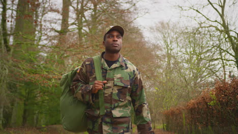American-Soldier-In-Uniform-Carrying-Kitbag-Returning-Home-On-Leave