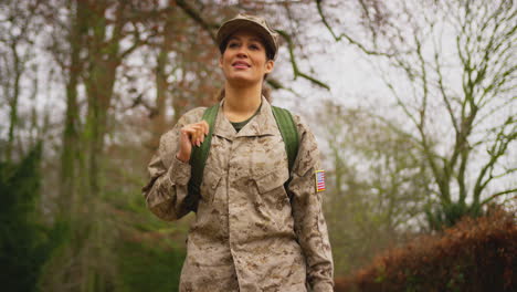 American-Female-Soldier-In-Uniform-Carrying-Kitbag-Returning-Home-On-Leave