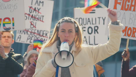 Group-Of-Protestor-With-Megaphone-Waving-Flags-On-Demonstration-March-For-Gender-Equality
