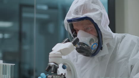 scientific-laboratory-of-development-of-bacteriological-and-biological-weapon-technician-is-dressed-protective-gown-with-mask-for-save-health