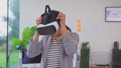 Female-Architect-In-Office-Using-VR-Headset-To-Design-New-Building