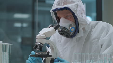 virologist-is-researching-new-virus-covid-19-in-medical-laboratory-wearing-protective-overall-and-respirator-for-saving-health-portrait-of-health-professional