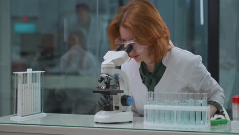 cellular-immunology-research-in-scientist-laboratory-woman-expert-is-exploring-analysis-and-medicaments-in-microscope-medical-experiment-and-test