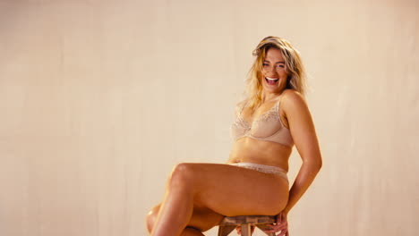 Studio-Shot-Of-Confident-Natural-Laughing-Woman-In-Underwear-Promoting-Body-Positivity