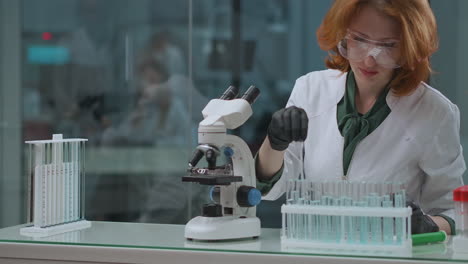 laboratory-of-ecological-expertise-woman-specialist-is-checking-water-samples-on-toxic-and-hazardous-using-microscope-for-researching-scientific-lab-with-modern-equipment