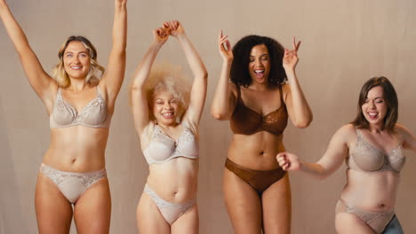Group-Of-Diverse-Women-Friends-One-With-Prosthetic-Limb-In-Underwear-Promoting-Body-Positivity